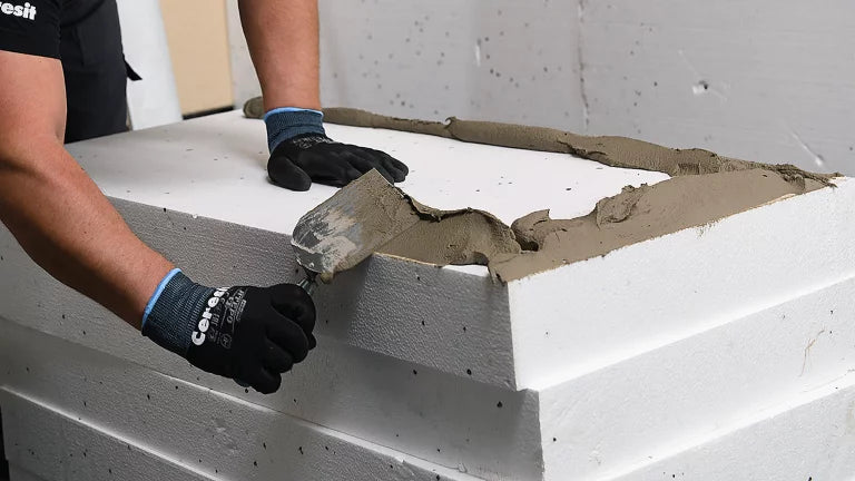 Installation of A1 non-combustible mineral wool insulation on a 15-metre UK residential building to meet 2026 fire safety standards.